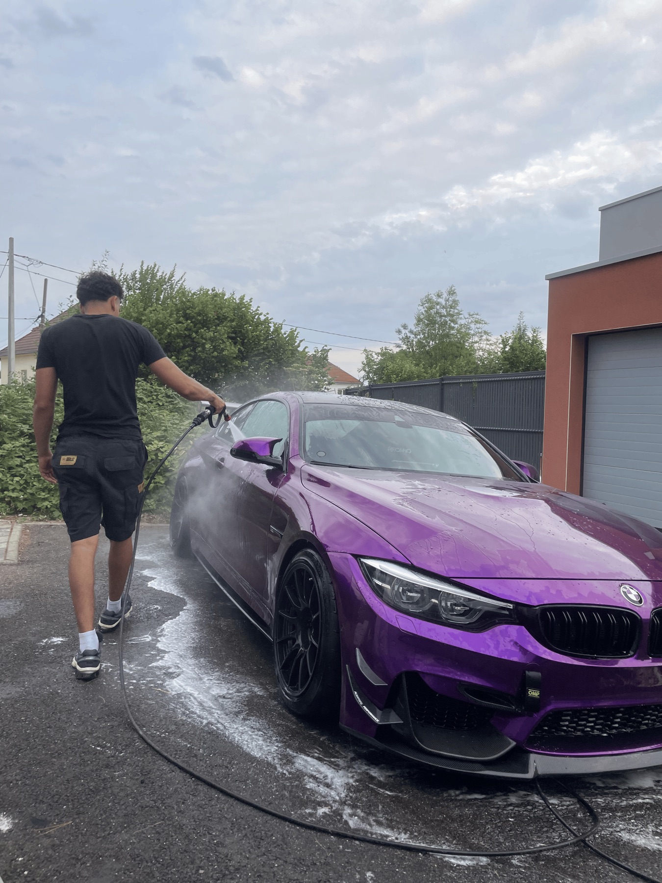 GoClean Lux mobile car cleaning on a purple BMW at the customer's location